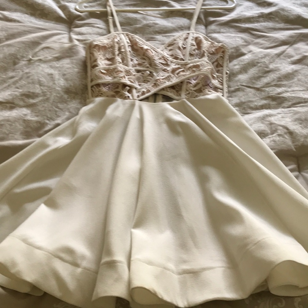 Adorable white dress, lace detailing along bust
